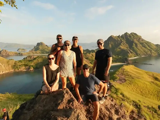 Travellers on the summit of Padar Island in Komodo National Park