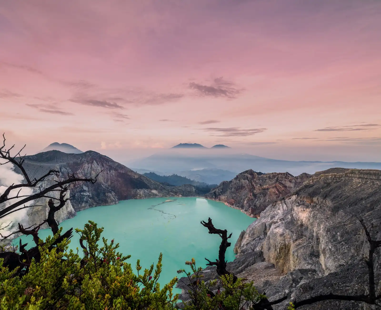 Turquoise acidic crater lake of Kawah Ijen at sunrise, East Java