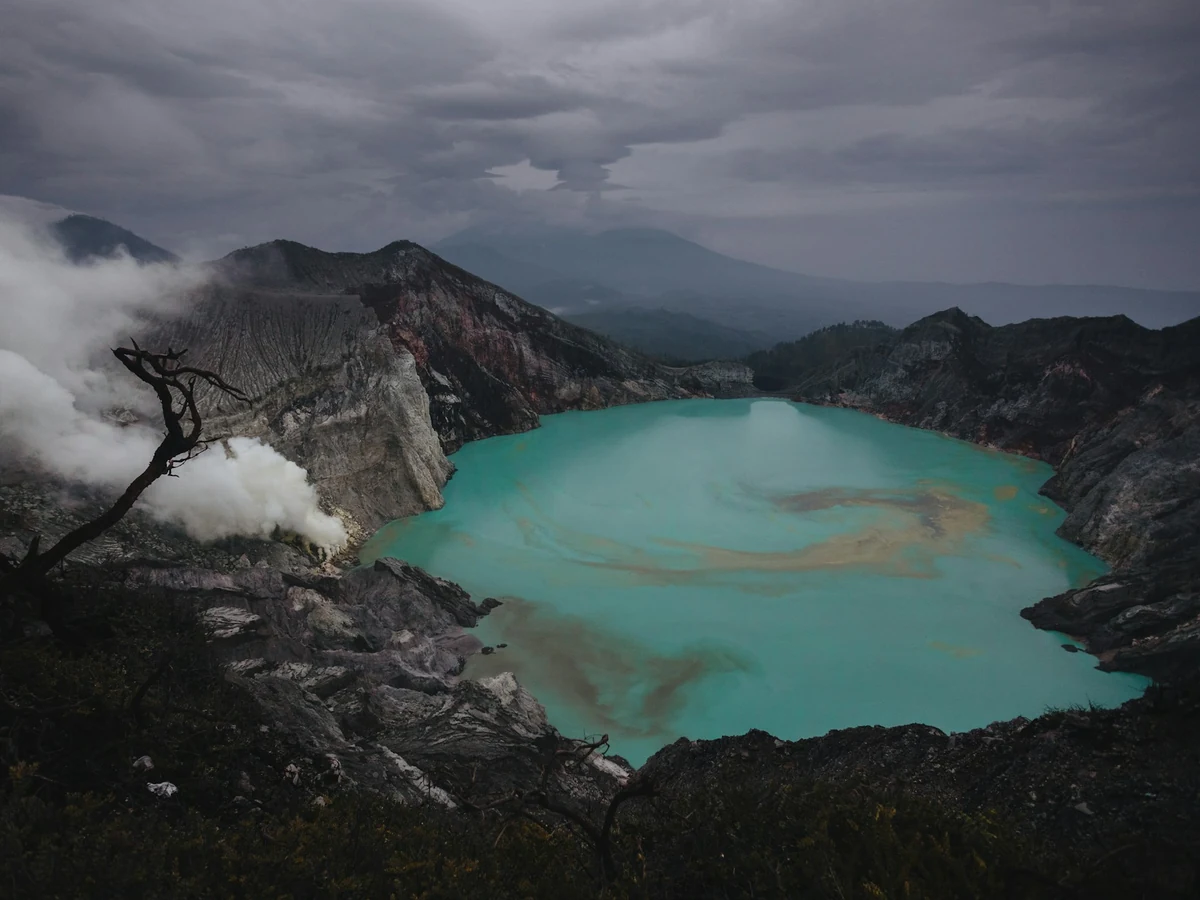 Grey rain clouds over the Kawah Ijen crater lake