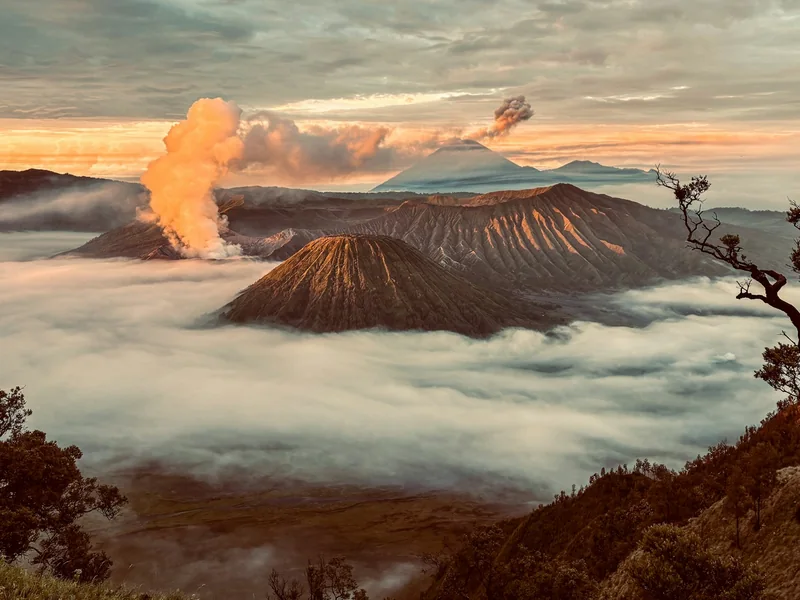 Mount Bromo at sunrise above the clouds