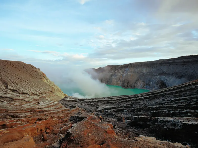 Ijen crater under a blue sky