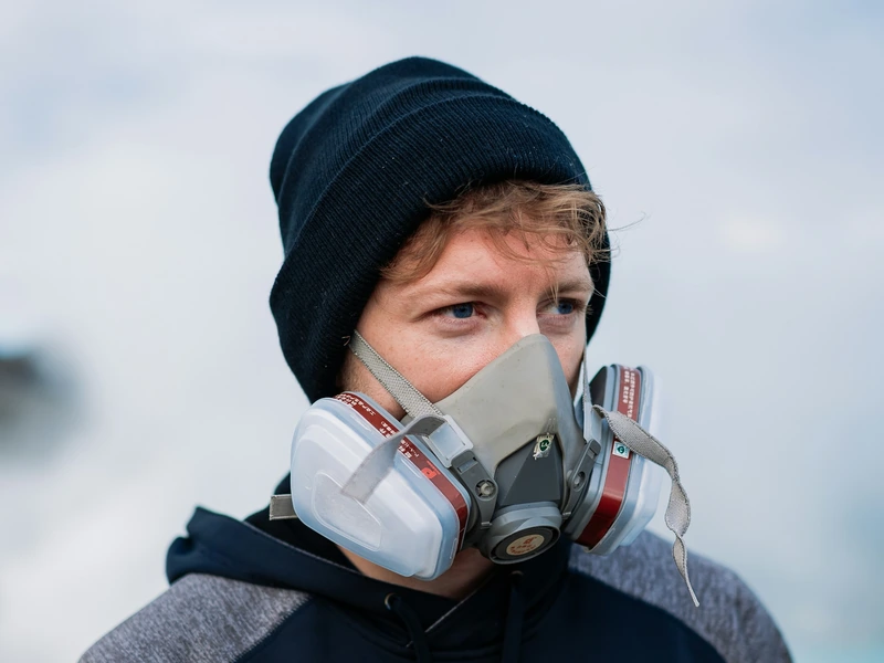 Hiker wearing a gas mask at the Ijen crater