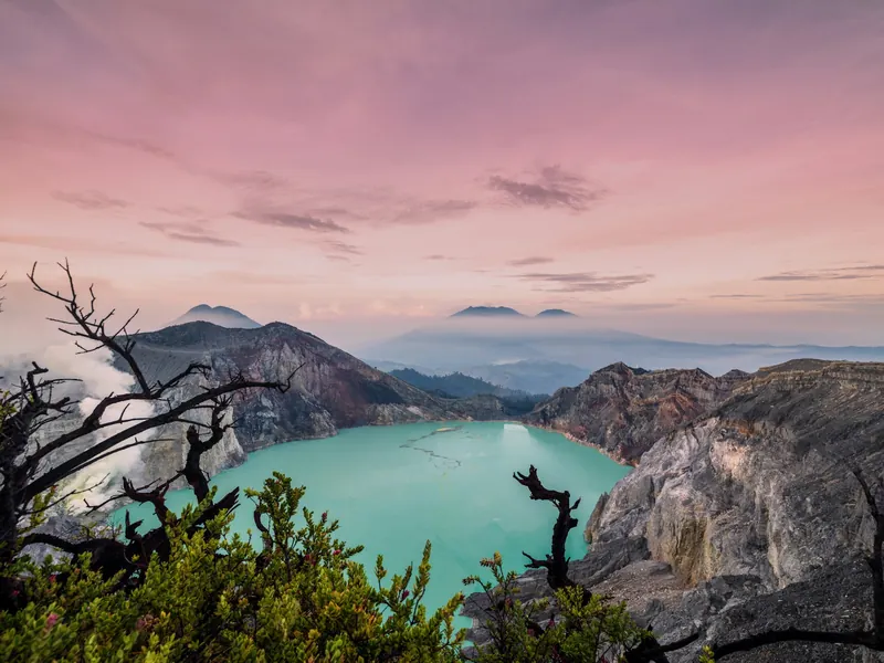 Pink sunrise over the Kawah Ijen crater lake