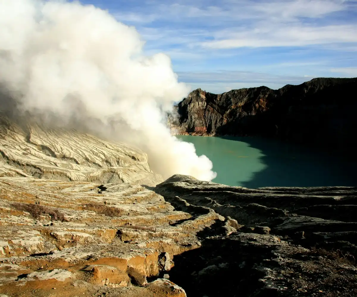 Steam drifting over the Ijen crater rim